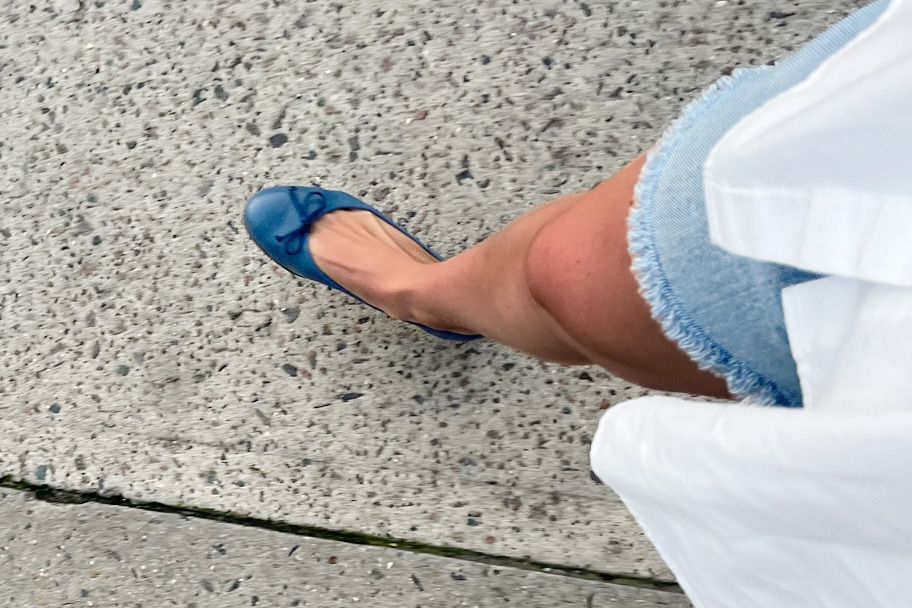 Person wearing Margaux The Demi Flats on concrete