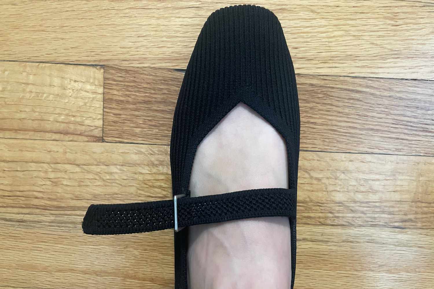 A person wears a single Vivaia Margot Square-Toe Mary Jane flat