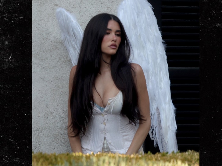 Madison Beer stuns in angel wing backgrid