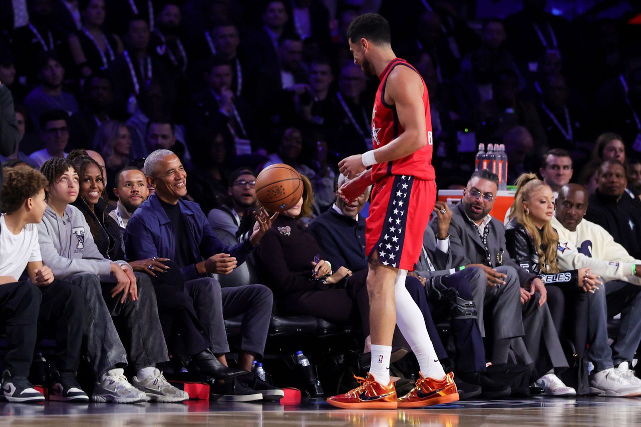 Former President of the United States Barack Obama passes a loose ball to Devin Booker #1 of the Phoenix Suns and Team USA Stars during the 75th NBA All-Star Game at Intuit Dome on February 15, 2026 in Inglewood, California Barack Obama passes a loose ball to Devin Booker of the Phoenix Suns and Team USA Stars during the 75th NBA All-Star Game. Ronald Martinez/Getty