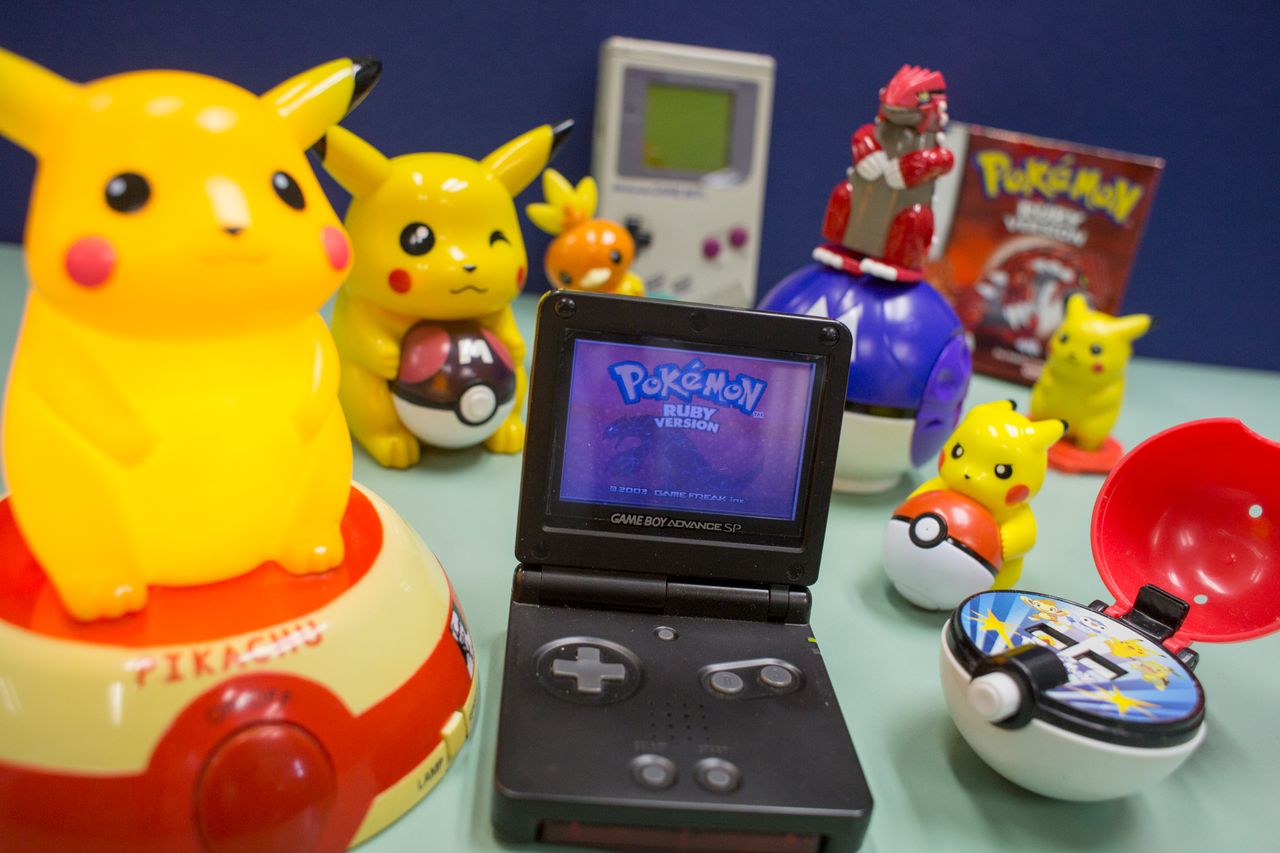 Pokémon Ruby on Game Boy SP with an original Game Boy in the backgroundCredit: May Tse/South China Morning Post/Getty