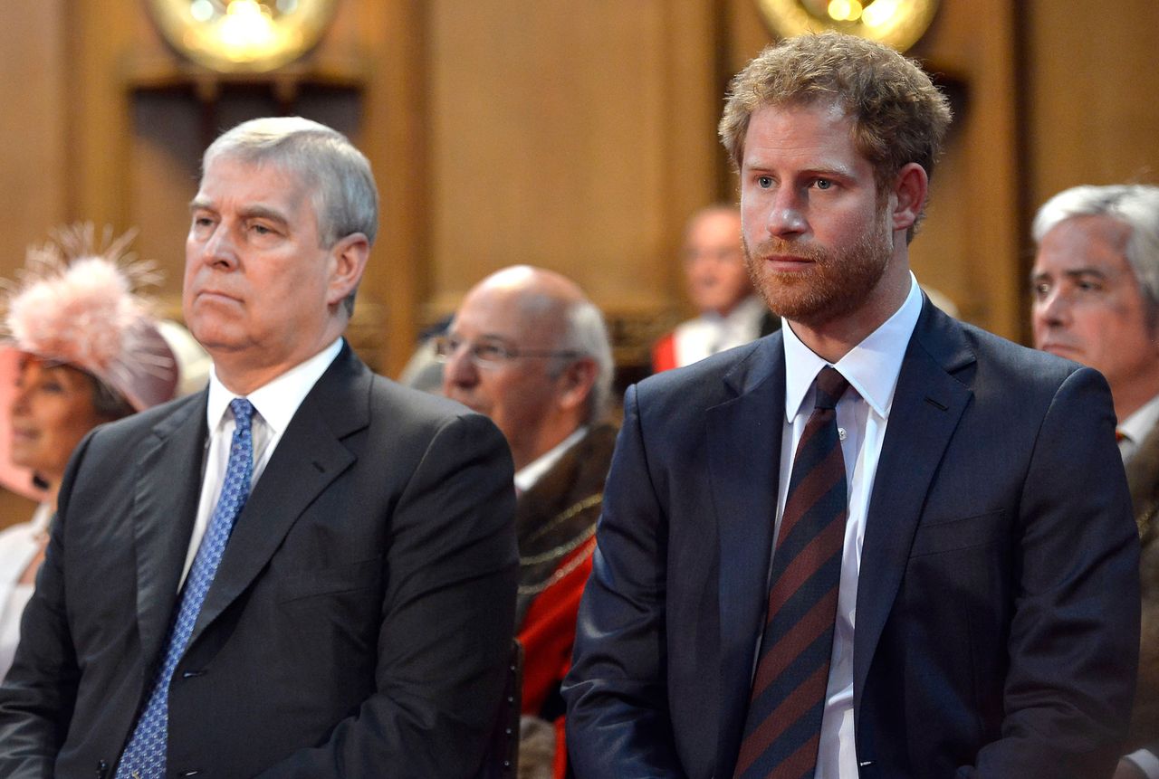 Prince Andrew, Duke of York and Prince Harry during a reception at the Guildhall following the National Service of Thanksgiving for Queen Elizabeth II's 90th birthday at St Paul's Cathedral on June 10, 2016 in London, United Kingdom. The former Prince Andrew and Prince Harry are pictured together in 2016 WPA Pool/Getty