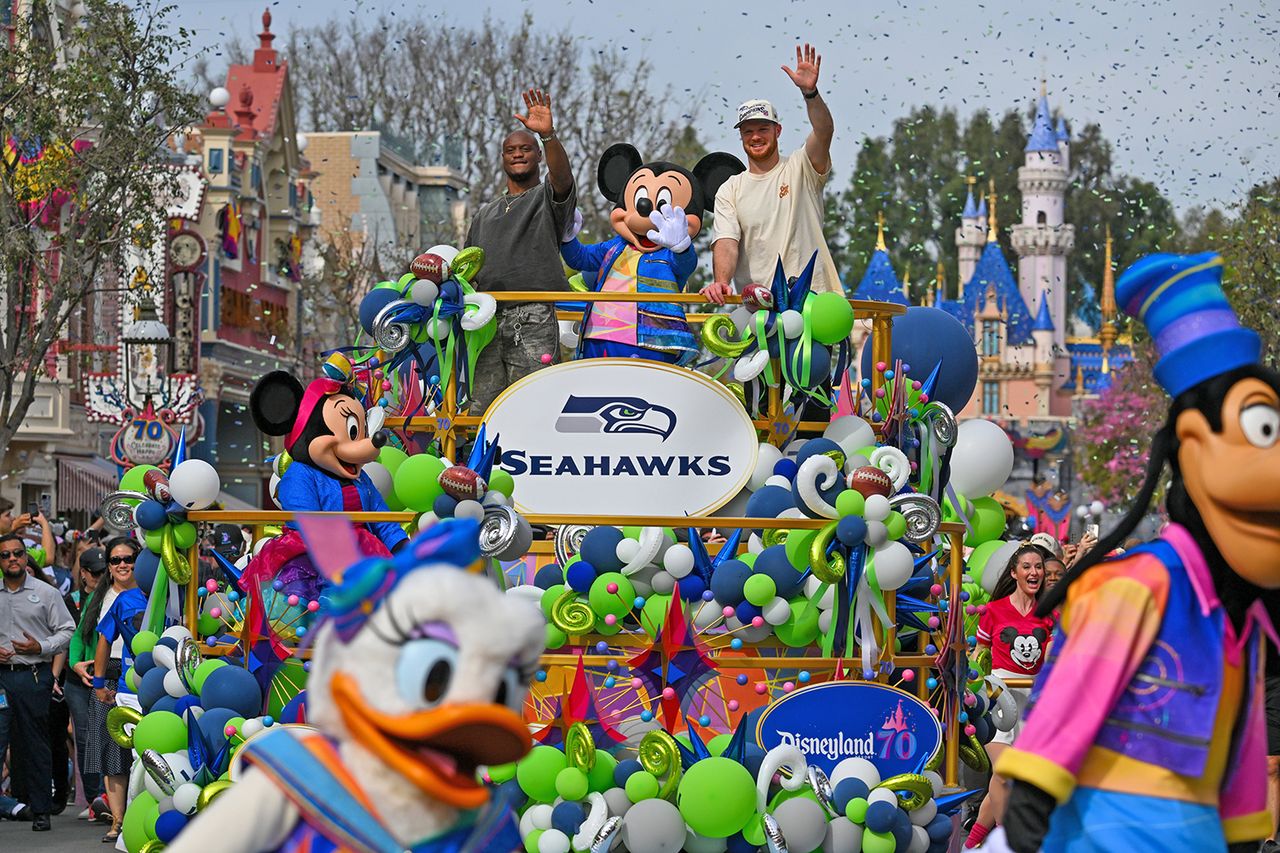 Sam Darnold and Kenneth Walker III at Disneyland day after Super Bowl win Jeff Gritchen, Orange County Register/SCNG