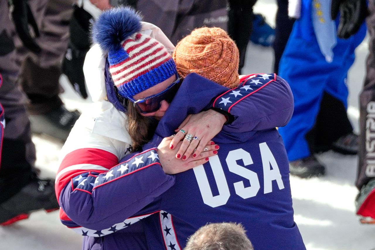 Breezy Johnson hugs fiancé Connor Watkins after his proposal AP Photo/Andy Wong