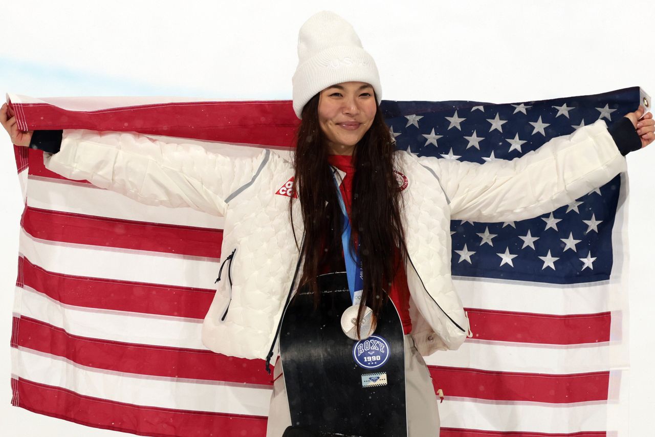 Silver medalist Chloe Kim is seen on the podium after the Women's Snowboard Halfpipe final.Credit: Ian MacNicol/Getty