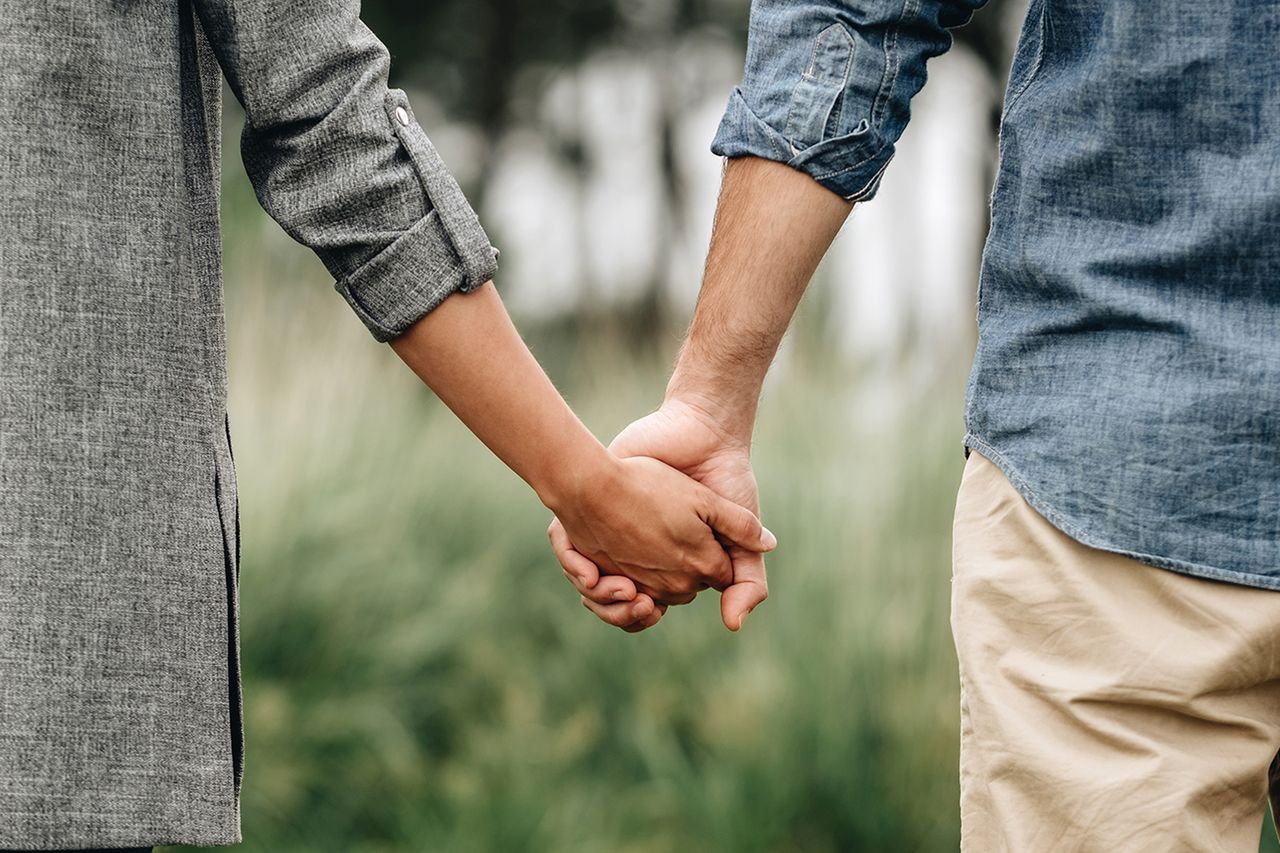 Stock image of couple holding hands Getty Images