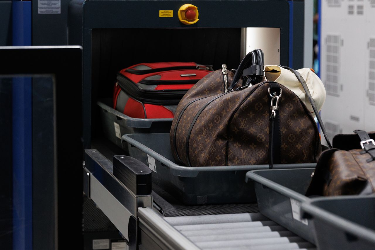 Luggage at an airport security checkpoint Shelby Tauber/Bloomberg via Getty