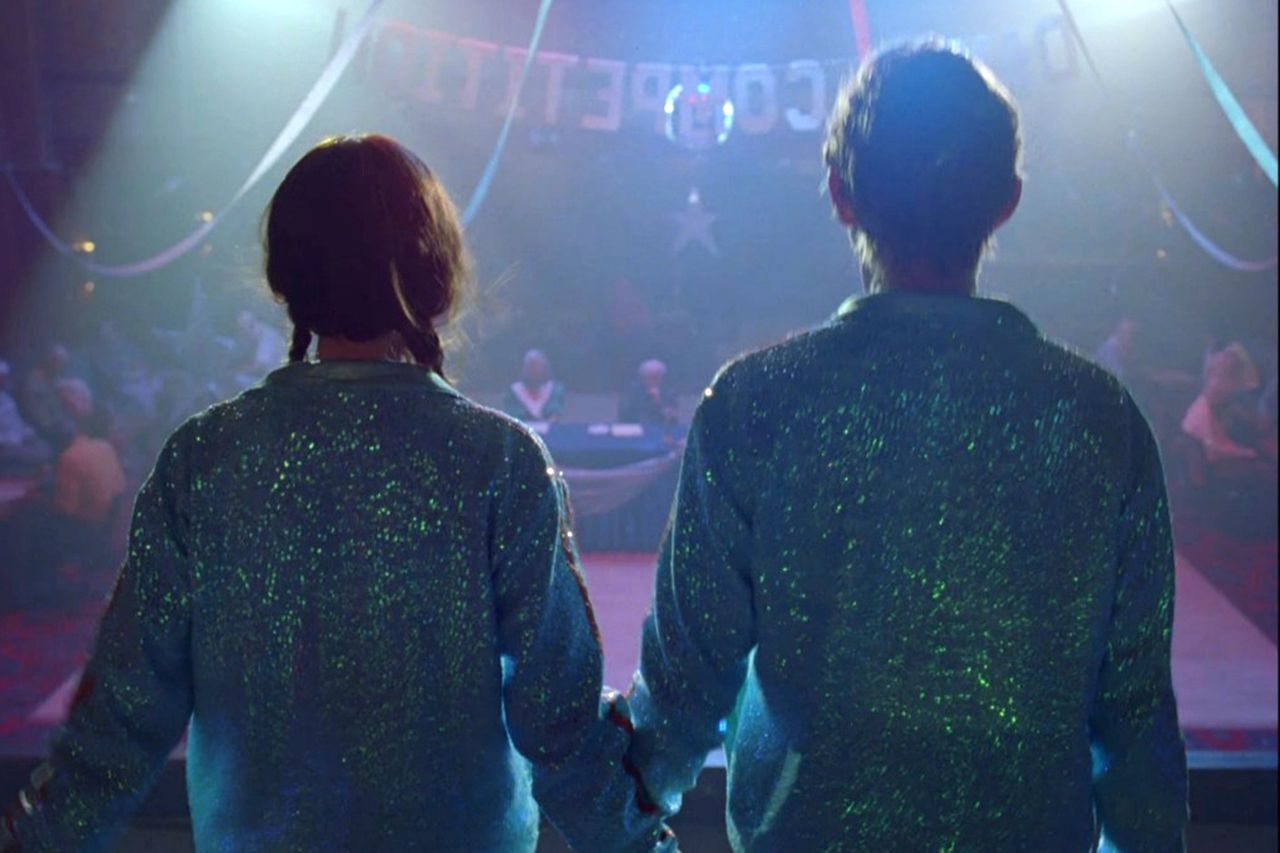 Taylor Swift and Domhnall Gleeson perform in front of the judges, including Barrie Reynolds, in the 'Opalite' music videoCredit: Taylor Swift/Youtube