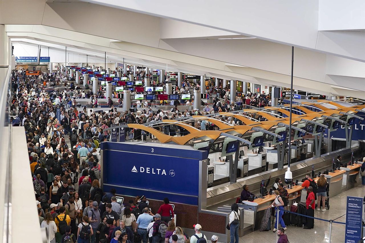 Travelers stand in long lines at Hartsfield-Jackson Atlanta International Airport on March 22, 2026Credit: Megan Varner/Getty