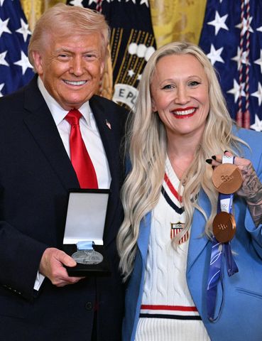 President Donald Trump (L) poses with US bobsledder Kaillie Armbruster HumphriesCredit: Jim WATSON / AFP via Getty