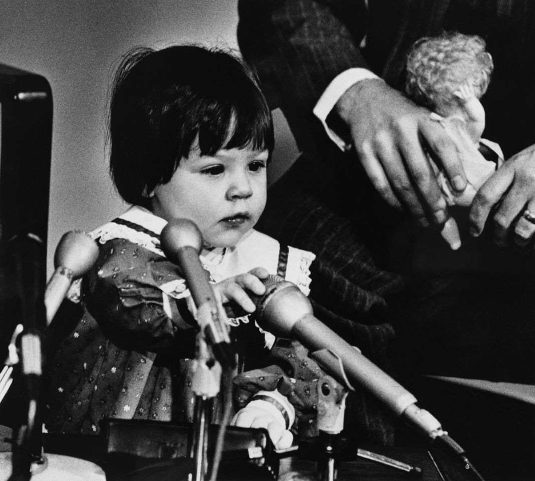 Elizabeth Jordan Carr plays with the microphones during a news conference. She and her parents, Judith and Roger Carr, of Westminster, MA returned to Norfolk General Hospital so that Elizabeth could undergo a series of tests. Elizabeth Carr as a toddler.Credit: Bettmann Archive/Getty