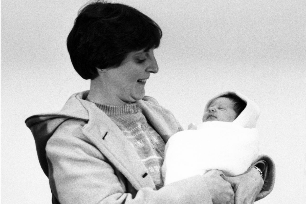 A smiling Judith Carr of Westminster, MA, looks down at her sleeping week-old infant Elizabeth Jordan Carr, America's first test tube baby, after their arrival at Logan International Airport from Norfolk, VA. A smiling Judith Carr looks down at her sleeping week-old infant Elizabeth Jordan Carr.Credit: Bettmann Archive/Getty
