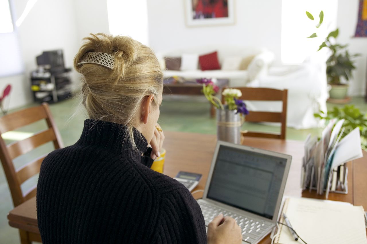 Stock image of woman on her computerCredit: Marc Romanelli / Getty Images