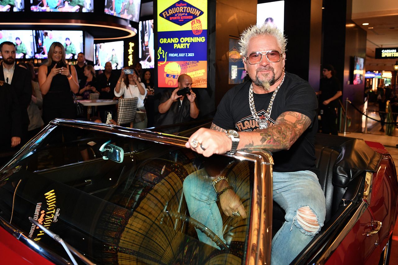 Guy Fieri in his iconic car in Las Vegas in 2023Credit: Denise Truscello/Getty