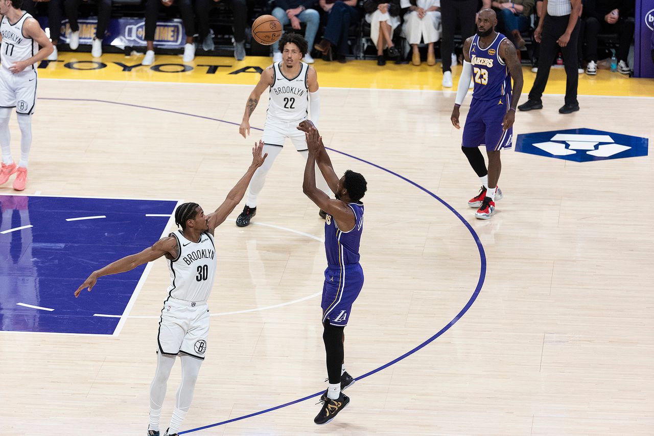 LeBron James plays alongside his son Bronny James at the Los Angeles Lakers' game against Brooklyn Nets on March 27Credit: Ringo Chiu via AP