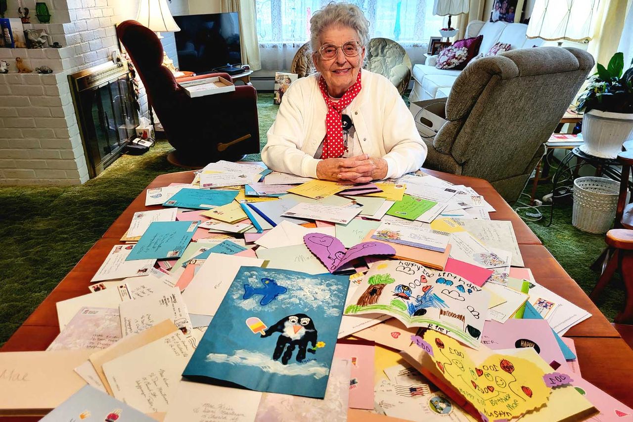 Mae Krier at home with her 100th birthday cards. She received over 500 and has determined to read each one.Credit: Courtesy of Deb Woolson