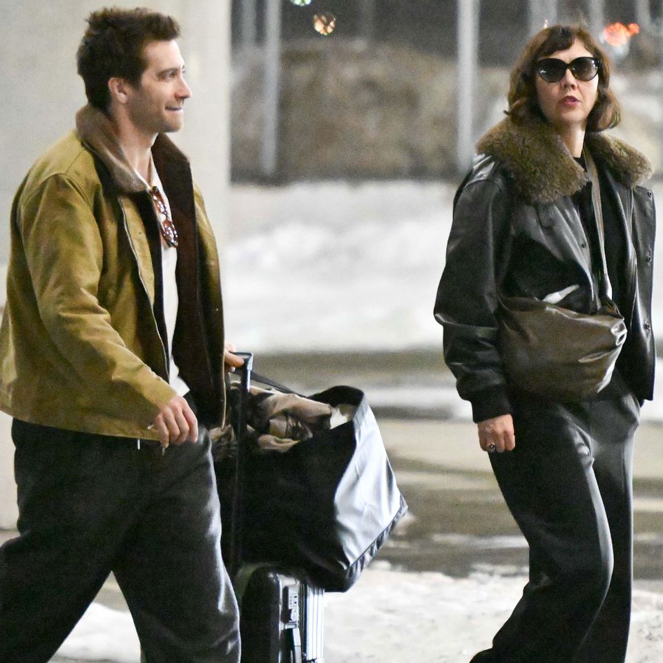 : Maggie and Jake Gyllenhaal are spotted arriving together at JFK Airport in New York City. The 48 year old American actress and her 45 year old brother cut a rare pose together at the arriving terminal before making their way to an awaiting car. Jake Gyllenhaal and Maggie GyllenhaalCredit: TheImageDirect.com