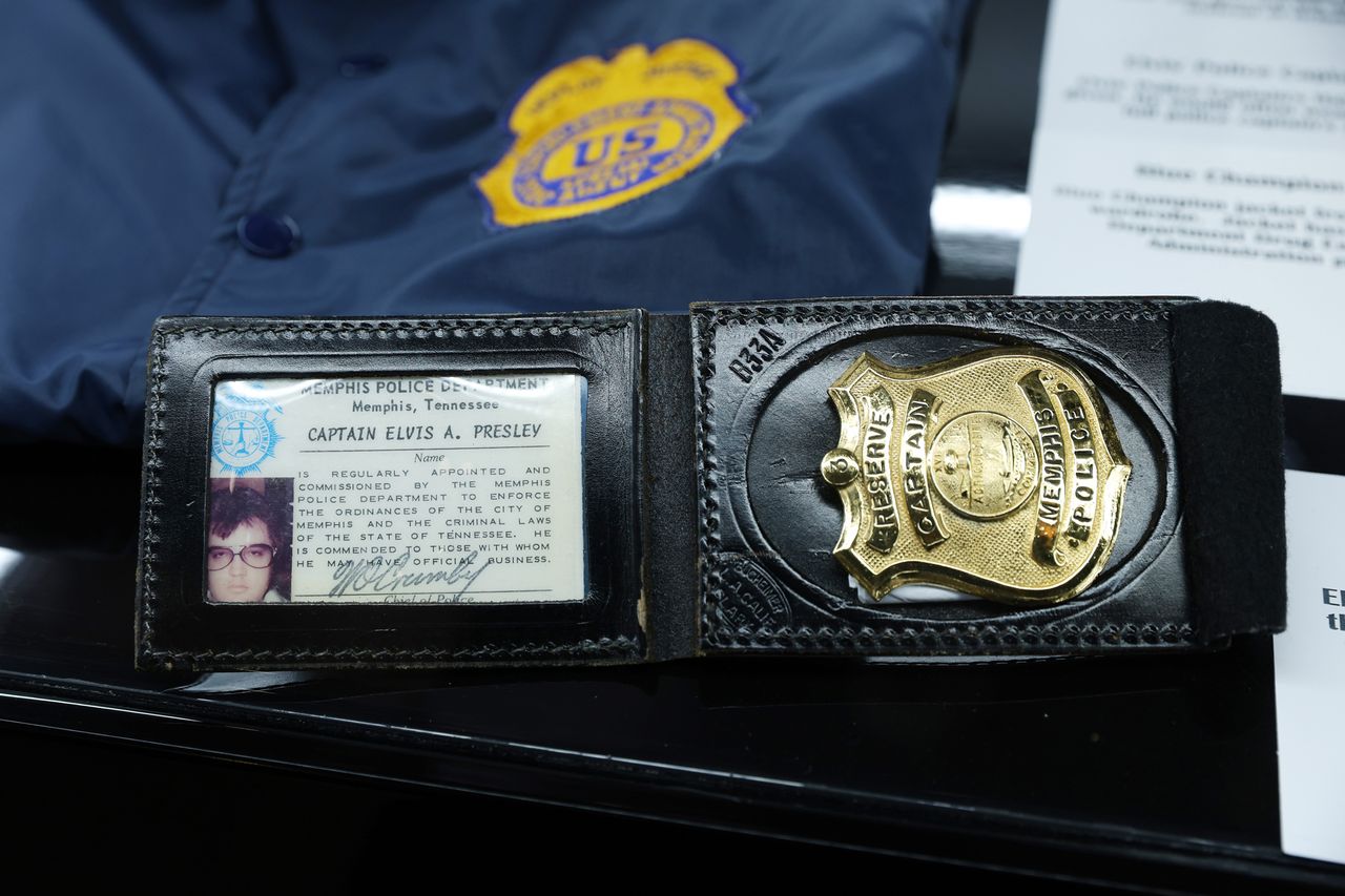 Police uniform and badge owned by Elvis Presley Elvis' honorary police badgeCredit: Lia Toby/Getty