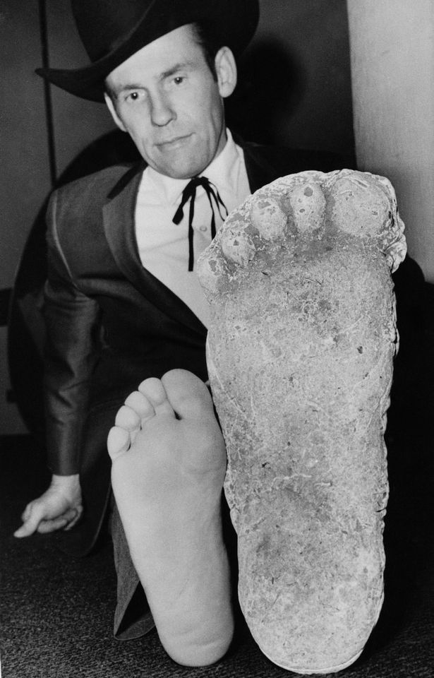 Roger Patterson (in 1967) comparing his foot with that of a cast he claimed to have made of a Bigfoot footprint.Credit: ap