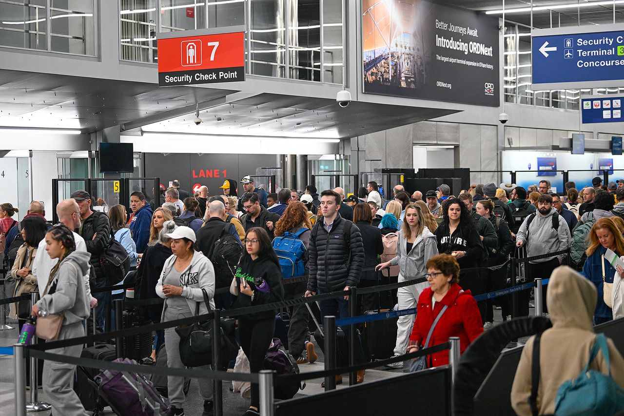 People wait in long TSA lines at Chicago O'Hare Airport on March 9.Credit: Peter Zay/Anadolu via Getty