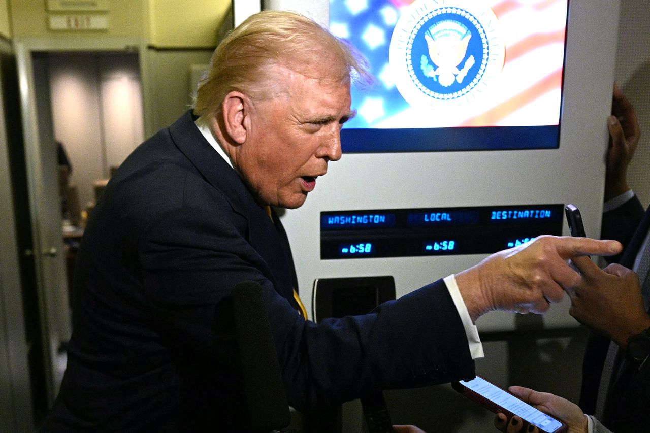 Donald Trump points as he speaks to reporters on Nov. 14Credit: JIM WATSON/AFP via Getty