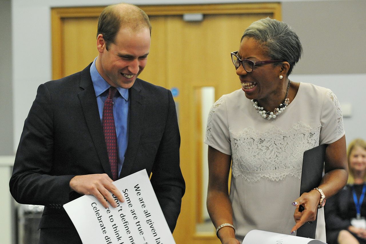 Britain's Prince William, Duke of Cambridge and The Diana Award Chief Executive Tessy Ojo, right, hold cards during a diversity and difference exercise during a visit to The Diana Award Prince William with Tessy Ojo, the CEO of the Diana Award, in Dec. 2015Credit: Rui Vieira - WPA Pool/Getty