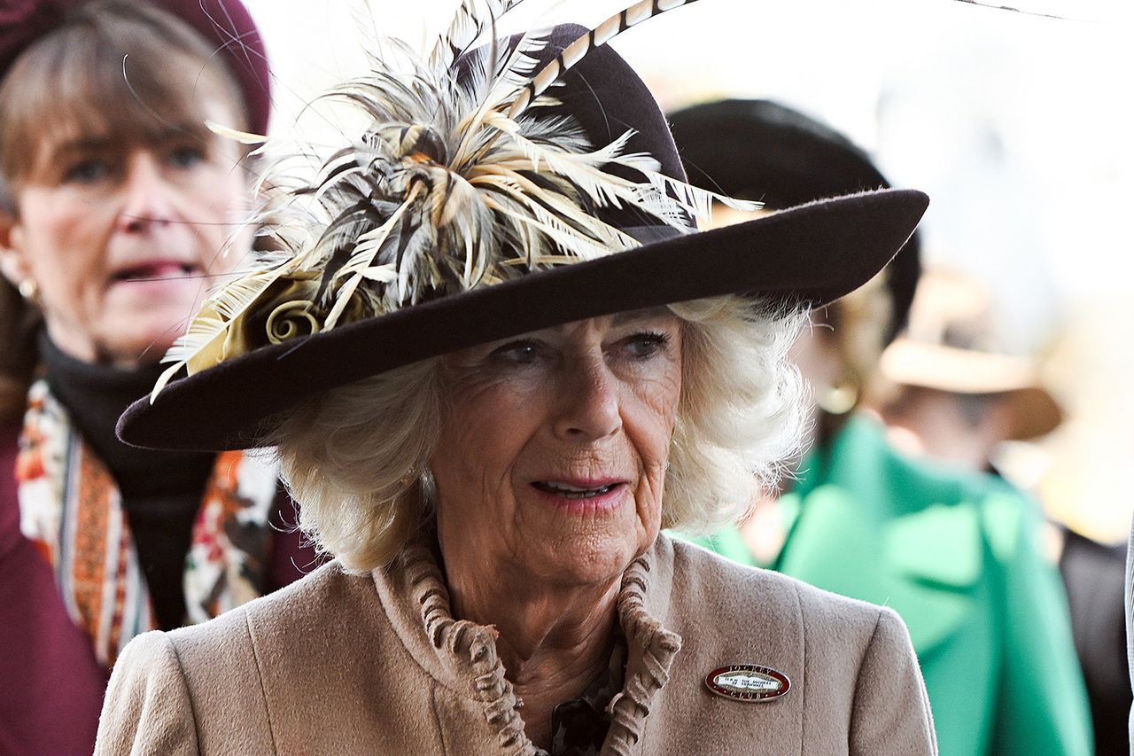 Queen Camilla reacts as she arrives to attend 'Ladies Day' on the second day of the Cheltenham Festival Queen Camilla.Credit: Eddie MULHOLLAND / POOL / AFP via Getty