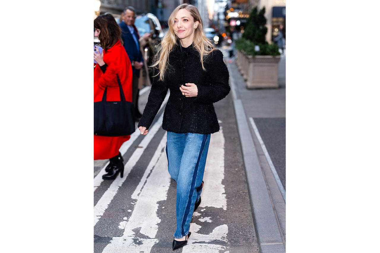 Amanda Seyfried walking on a city street wearing a black top and jeans Credit: TheStewartofNY / GC Images / Getty Images
