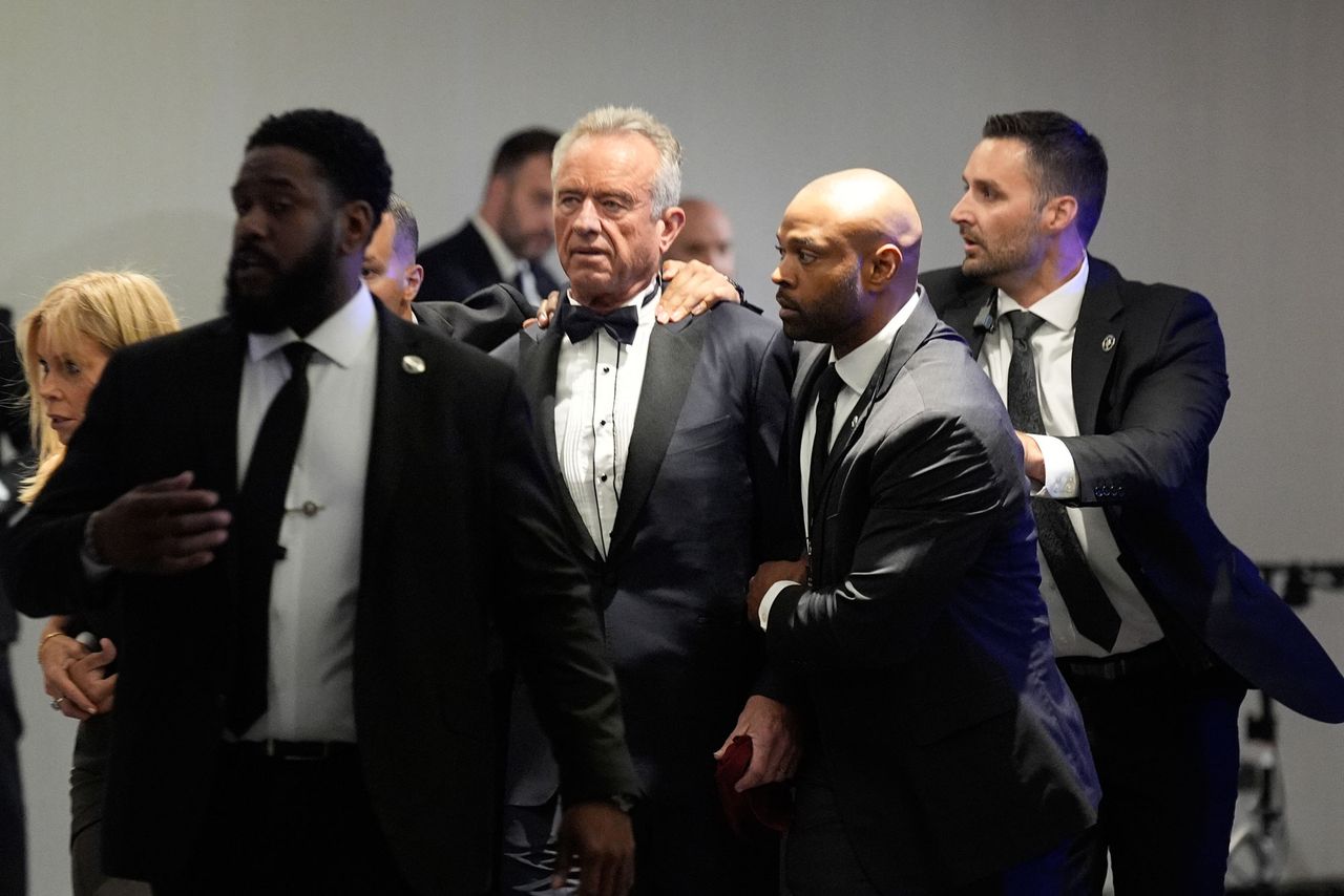 Robert F. Kennedy Jr. and Cheryl Hines are escorted out of the White House Correspondents' dinner on April 25, 2026Credit: Yuri Gripas/Abaca/Bloomberg via Getty