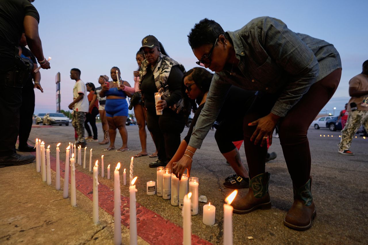 People light candles during a prayer vigil for the victims of the shooting on Sunday, April 19Credit: AP Photo/Gerald Herbert