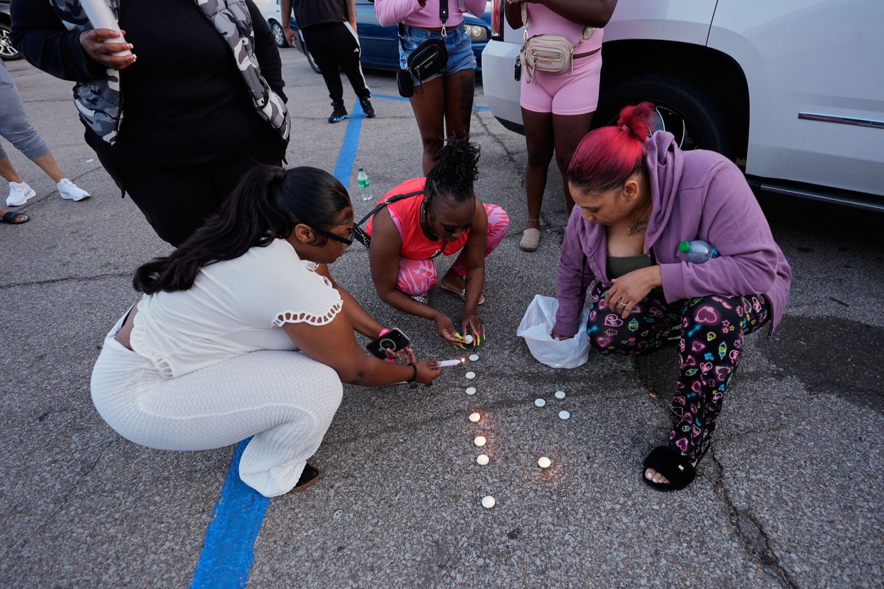 People light candles during a prayer vigil for the victims of the mass shooting on Sunday, April 19Credit: AP Photo/Gerald Herbert