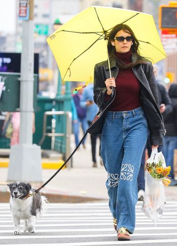 Canadian actress Nina Dobrev is seen dealing with a broken umbrella on a windy day in New York City while running errands and walking her dog. Nina DobrevCredit: Fernando Ramales / BACKGRID