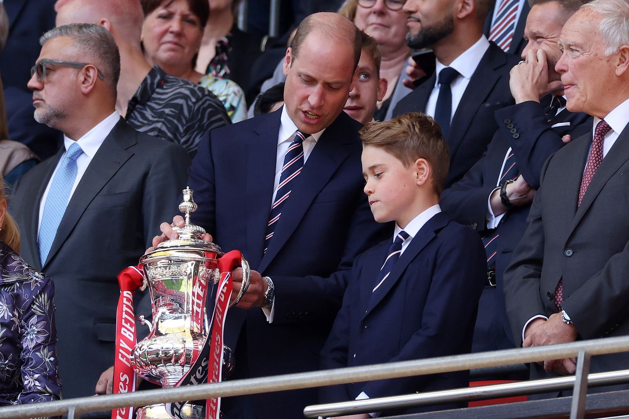 Prince William and Prince George look at the Emirates FA Cup Trophy after the Emirates FA Cup FinalCredit: Eddie Keogh - The FA/The FA via Getty