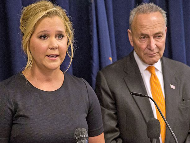 Amy Schumer and U.S. Senator Chuck Schumer (D-NY) speak at a press conference calling for tighter gun laws in N.Y.C. on Aug. 3, 2015Credit: Andrew Burton/Getty Images