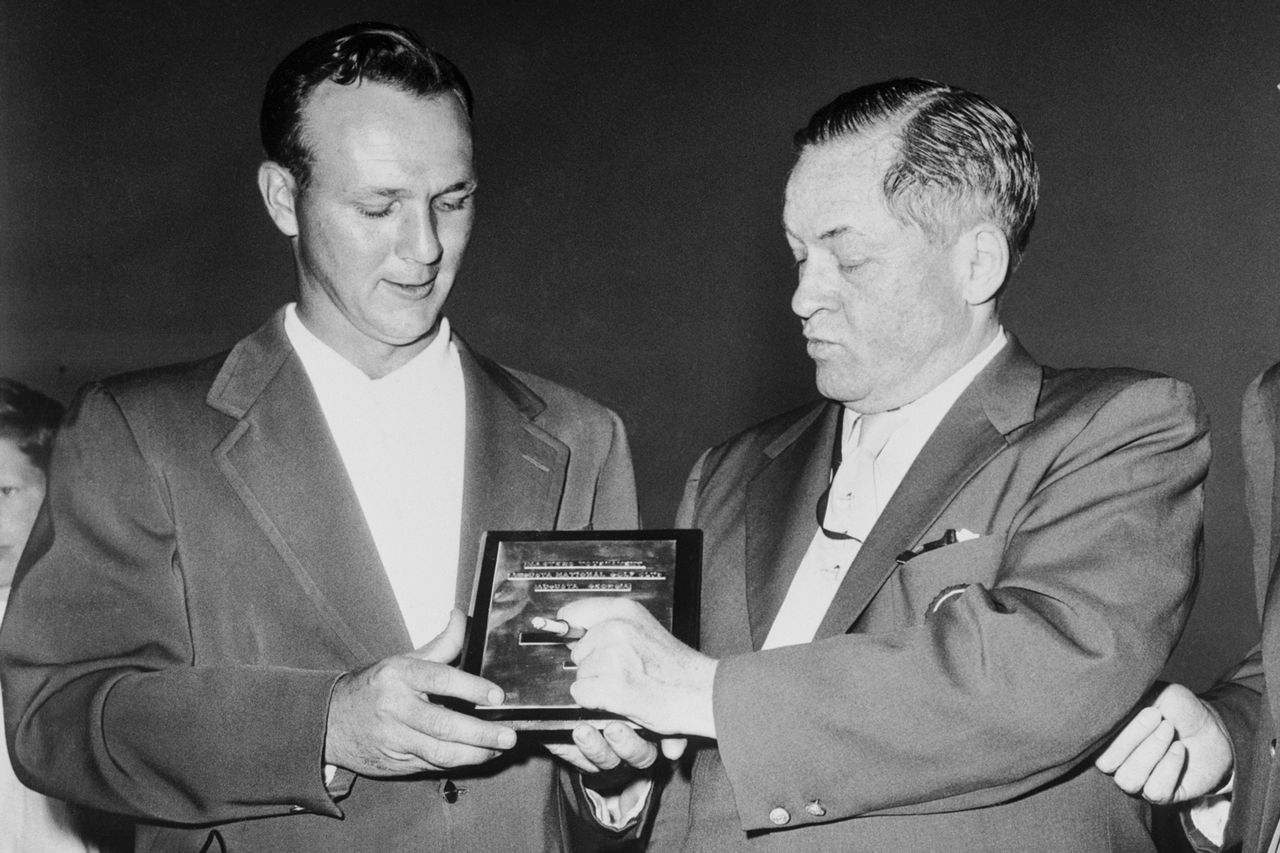 Arnold Palmer is presented with the championship plaque after winning the Masters Tournament.Credit: Bettmann/Getty