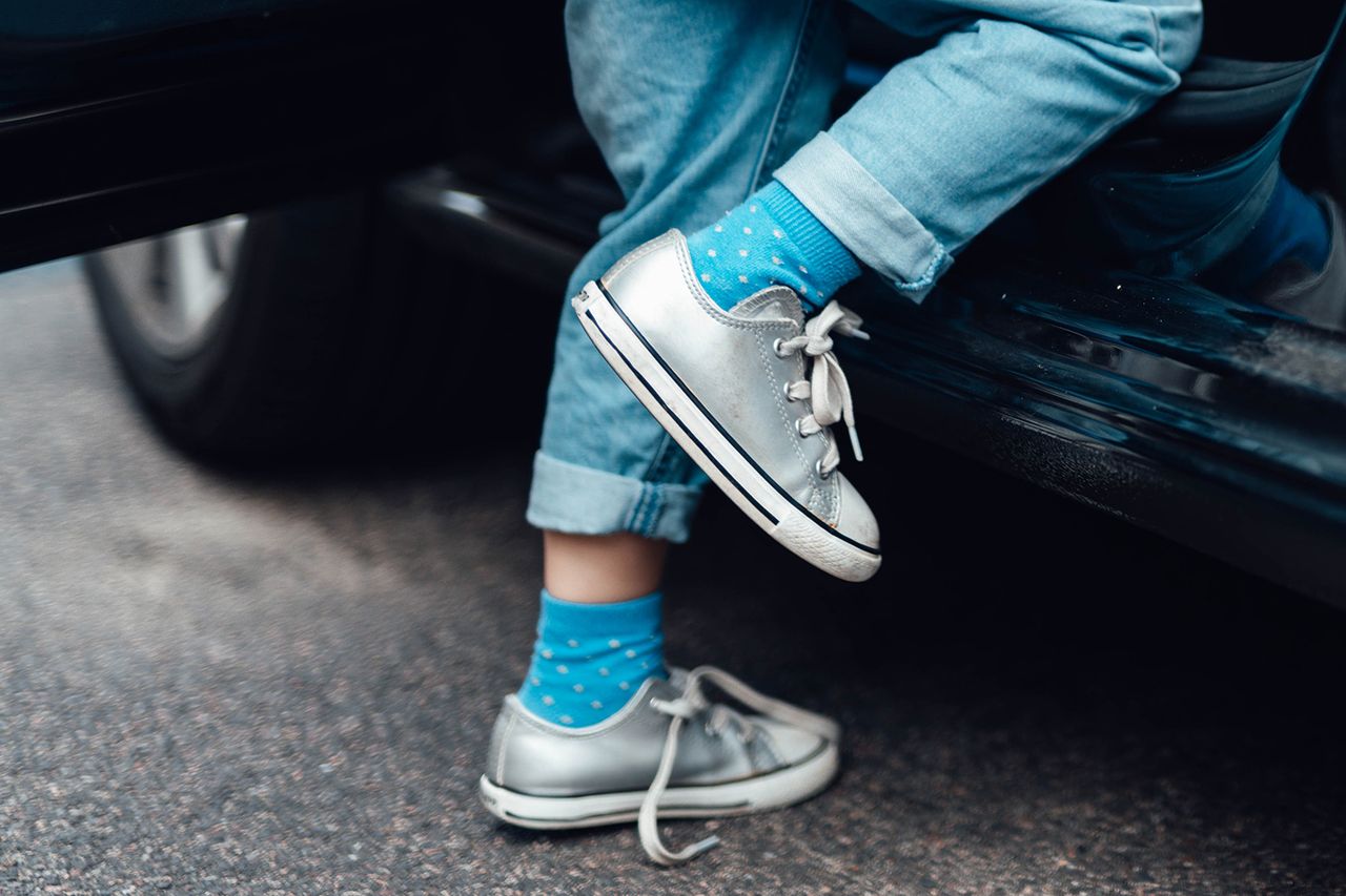 Cropped shot of a young child getting into a car, going to school. Daily routine for a young family. A stock photo of a child getting into a carCredit: Getty