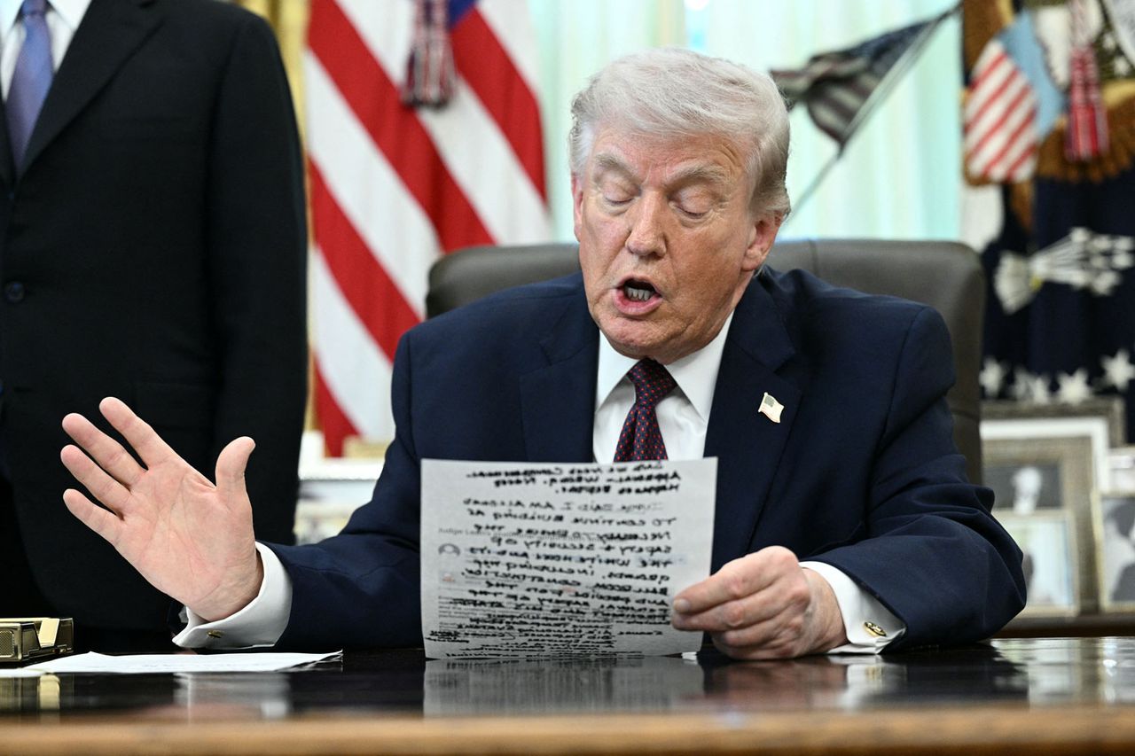 President Donald Trump reads from his notes during an Oval Office press conference on March 31, 2026Credit: Brendan SMIALOWSKI / AFP via Getty