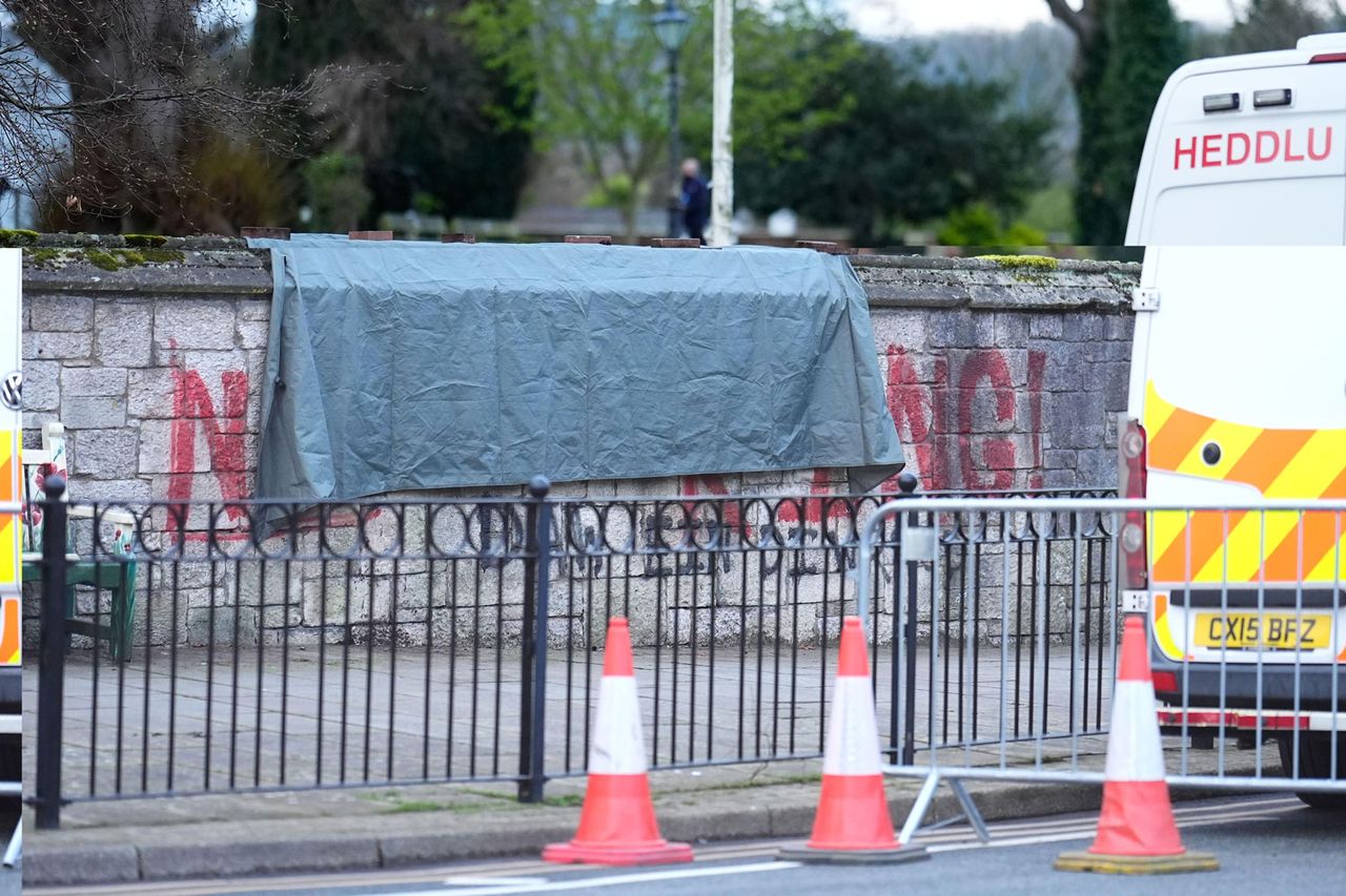 A tarpaulin cloth covers spray painted graffiti which says Not My King on the wall outside St Asaph Cathedral in North Wales, where King Charles III and Queen Camilla will attend the Royal Maundy Service later today. It is the first time the Royal Maundy Service has been held in Wales since 1982 and only the second time in its history. A tarp covering the spray painted graffiti on the wall outside St Asaph Cathedral in North Wales on April 2, 2026.Credit: Alamy