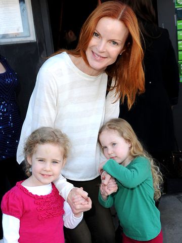 Marcia Cross posing with twin daughters Eden and Savannah.Credit: WireImage
