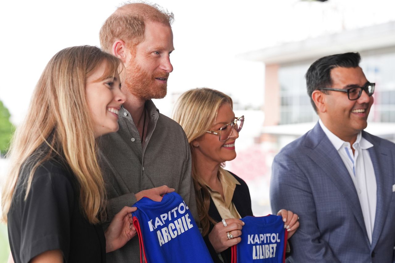 Prince Harry, Duke of Sussex is presented with Western Bulldogs Archie and Lilibet jerseys during a visit to Movember at the Western Bulldogs HQ at Mission Whitten Oval Prince Harry is gifted Western Bulldog jerseys for Prince Archie and Princess Lilibet at Mission Whitten Oval in Melbourne, Australia, on April 15, 2026Credit: Jonathan Brady-Pool/Getty