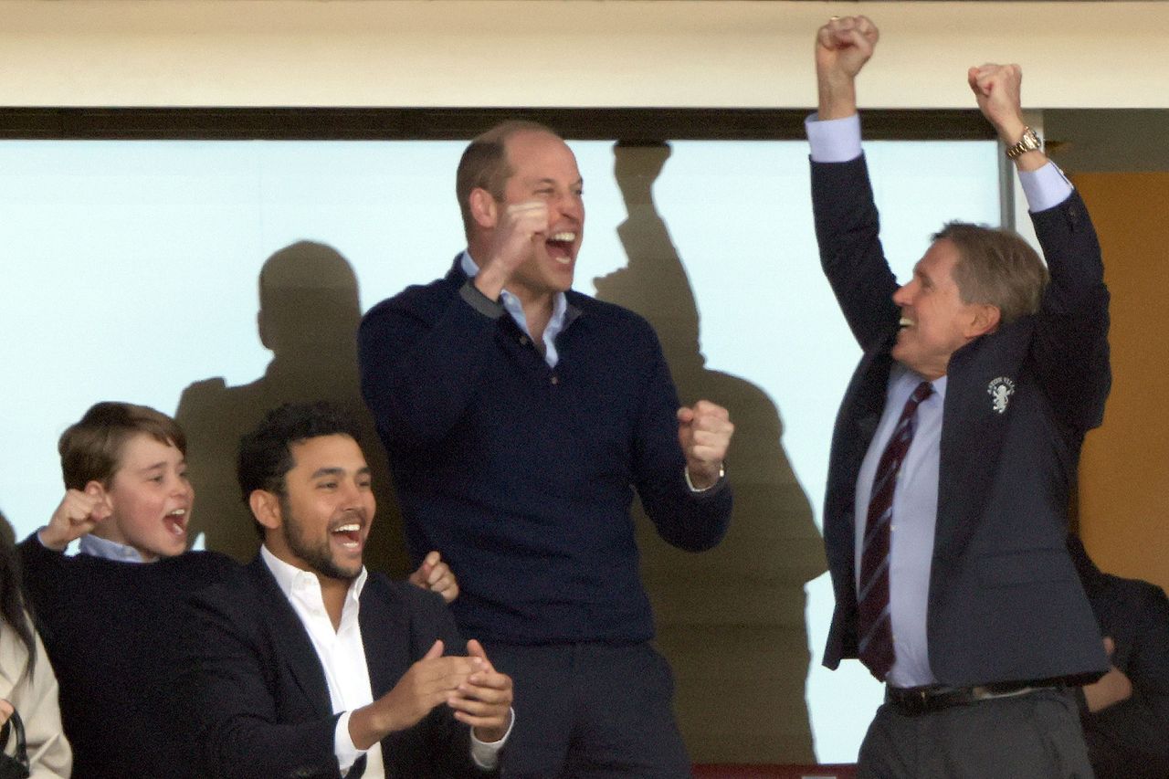 Prince George and Prince William celebratingCredit: Paul Marriott/Shutterstock