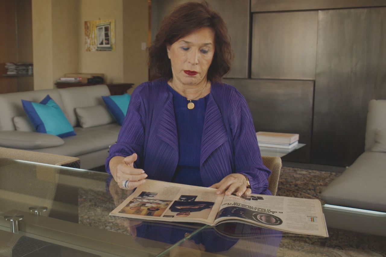 Judith Richter looks at the image of her father in 'Life' magazine in 'The Last Twins.'Credit: PBS