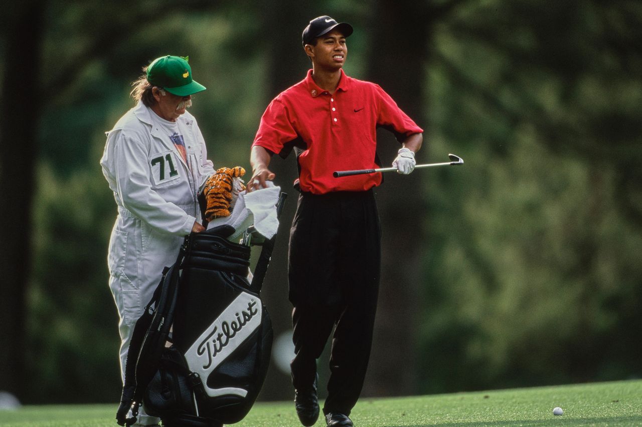 Tiger Woods with caddie Mike Fluff Cowan during the 61st US Masters Tournament on April 13th, 1997 in Augusta, Georgia.Credit: David Cannon/Allsport/Getty