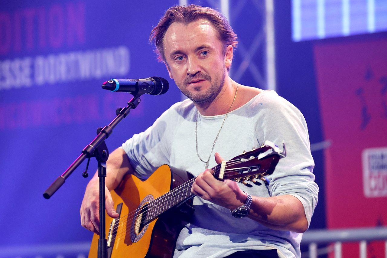 Actor Tom Felton at the German Film and Comic Con Winter Edition 2023 in the exhibition hall. Dortmund, 03.12.2023 Tom Felton plays guitar in 2023Credit: Action Press/Shutterstock