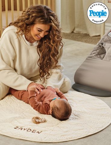 Tori Kelly with her son in his nursery.Credit: Crate & Kids