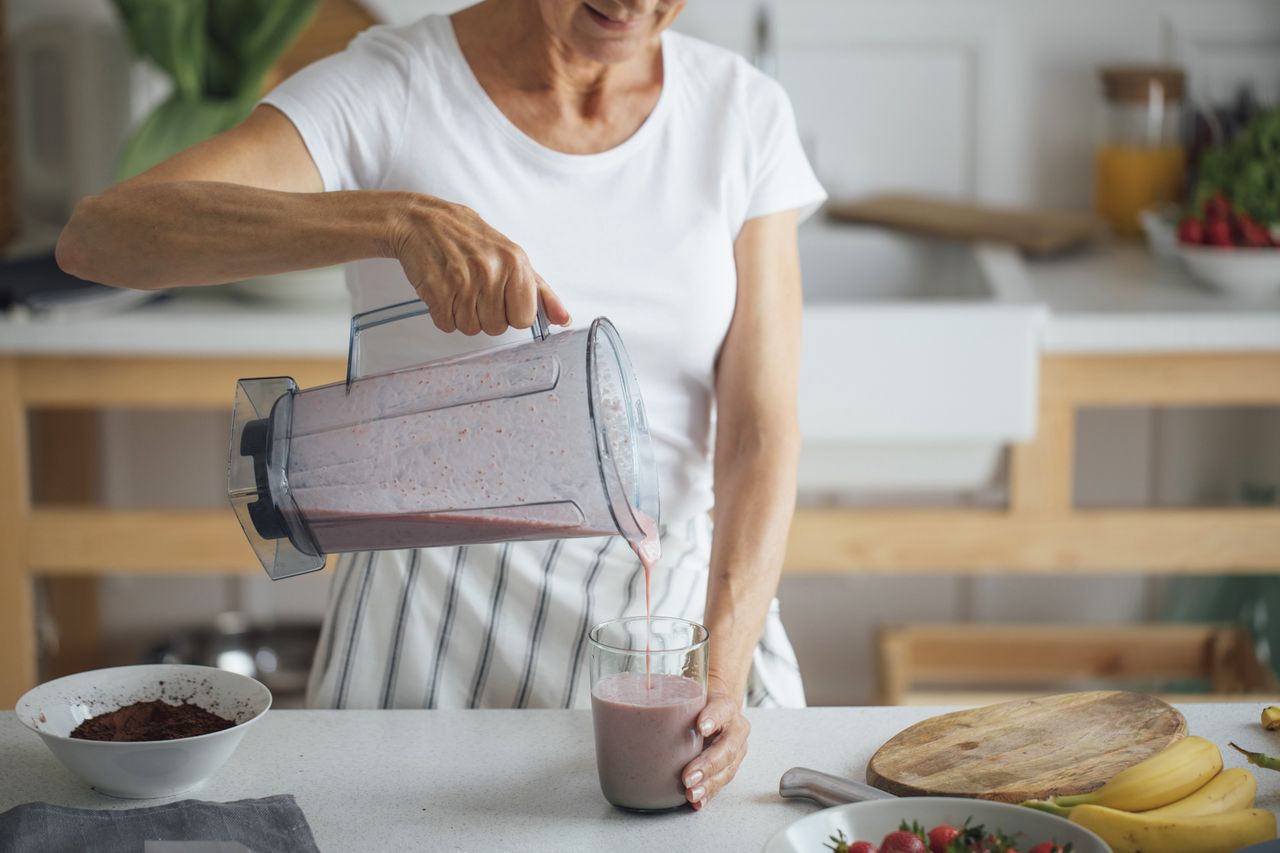 Stock image of a woman making a smoothieCredit: Getty