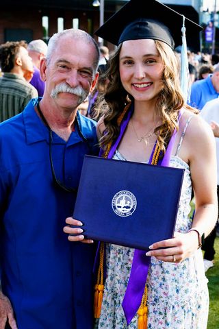Alan Kent (left) and Chloe Huddle (right) on her graduation day.Credit: Ralph Freso/Grand Canyon University News