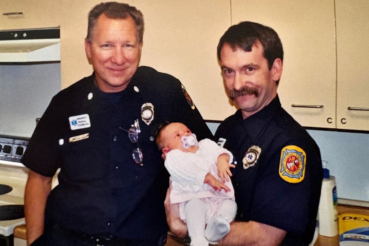 Alan Kent (right) holding Chloe Huddle as a baby.Credit: Courtesy Stacy Huddle