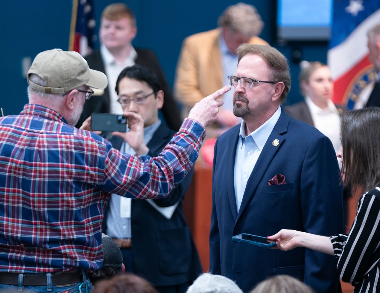 Veteran Sam Bingham, left, points at Rep. Chuck Edwards, R-N.C., at a town hall on March 13, 2025, in Asheville, N.C.Credit: Sean Rayford/Getty