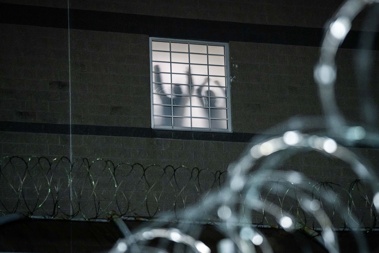 Detainees stand by a window inside the federal immigration center at Delaney Hall in Newark, where ICE is housing detained immigrants on May 26, 2026 in Newark, New Jersey. Detainees stand by a window inside the federal immigration center at Delaney Hall in Newark on May 26.Credit: Adam Gray/Getty